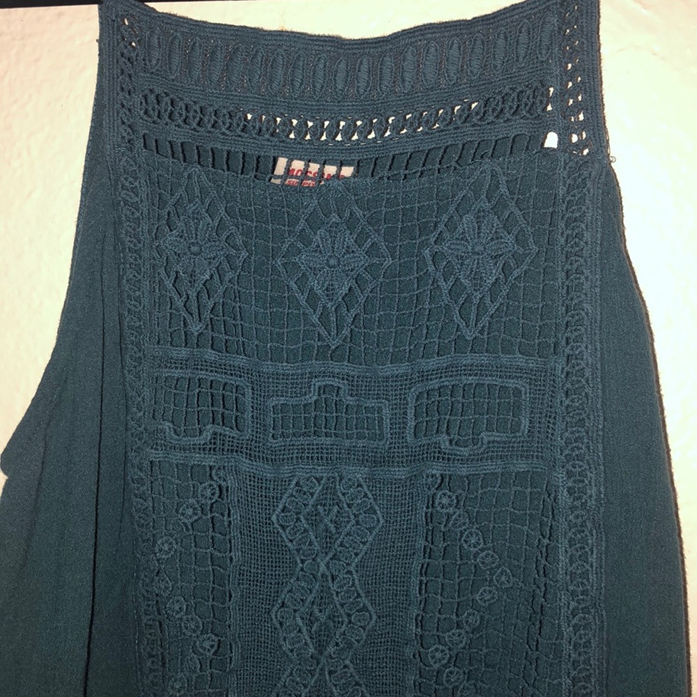 A turquoise tank top